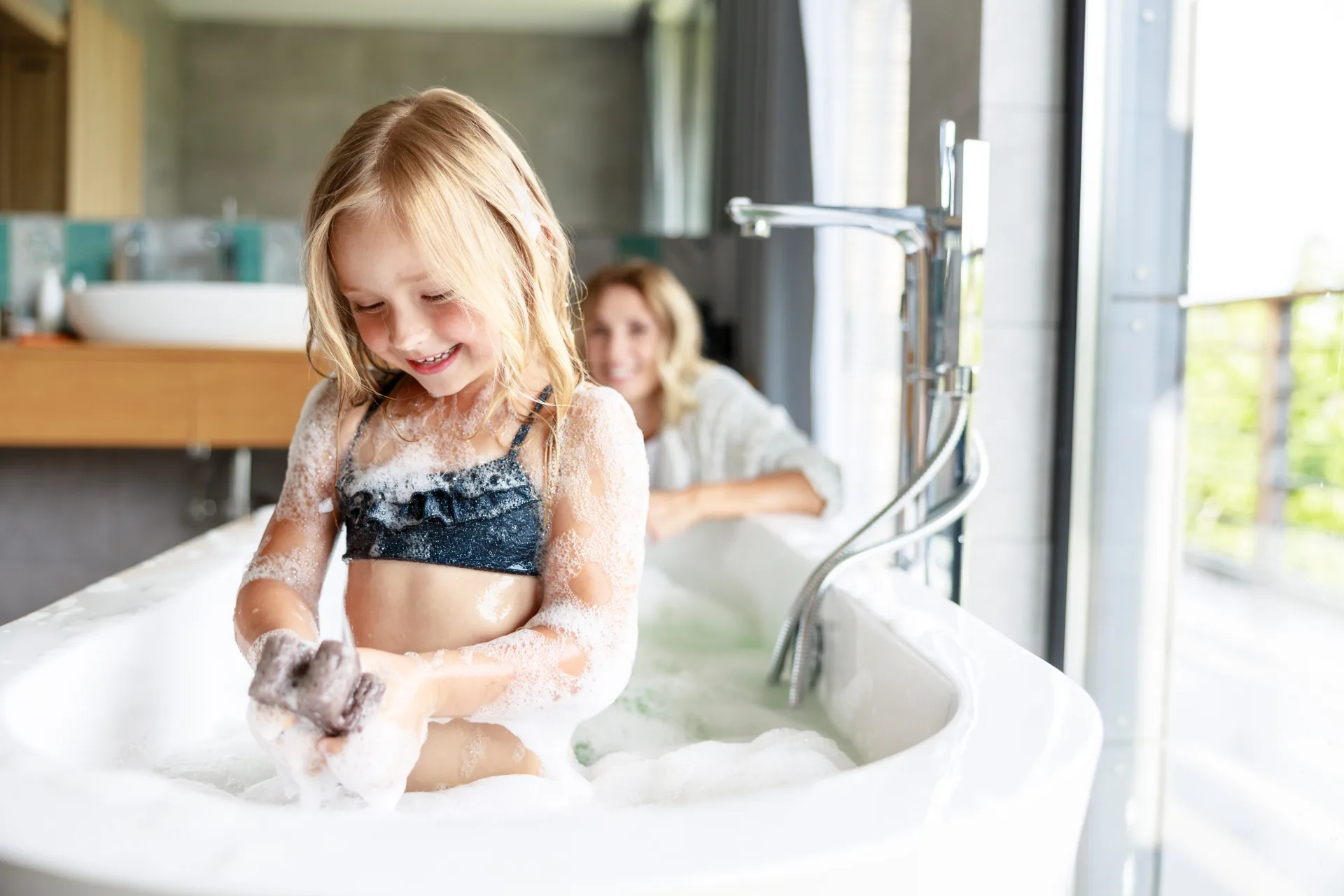 Child enjoying a refreshing bath with clean, filtered water